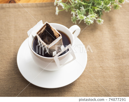 Brewing hot coffee with a drip bag for cups Brewing hot coffee with a drip bag for cups 74877291