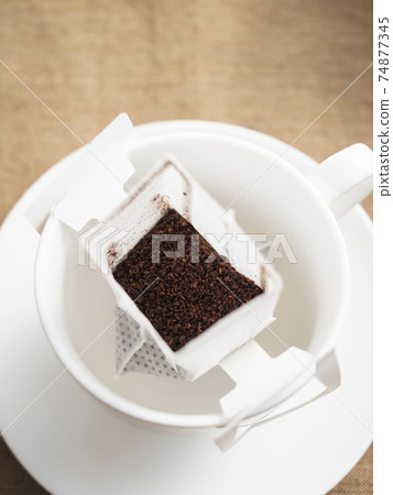 Brewing hot coffee with a drip bag for cups Brewing hot coffee with a drip bag for cups 74877345
