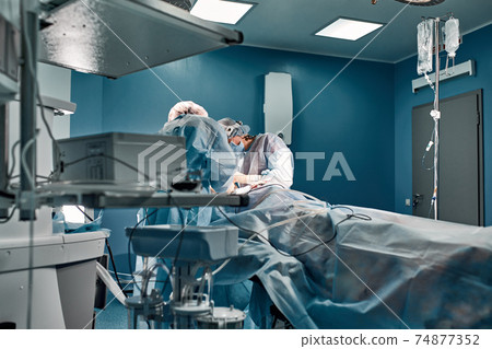 A team of surgeons is fighting for life, for a real operation, for real emotions. The intensive care team is fighting for the life of the patient. Saving life, the struggle for life 74877352