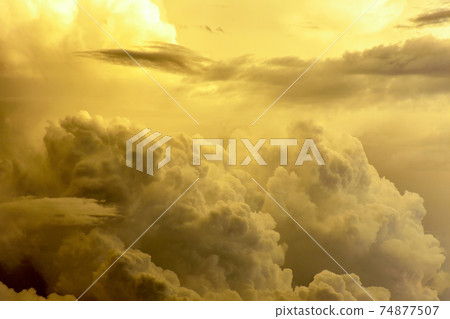 Strong rain clouds at sunset Strong rain clouds at sunset 74877507