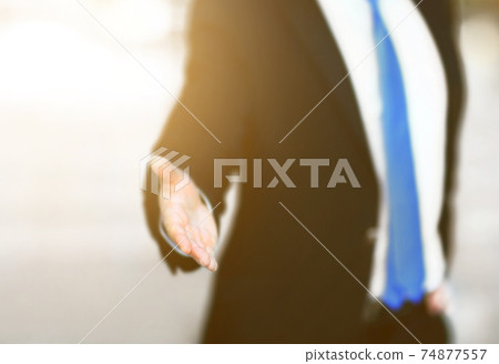 A business man with an open hand 74877557