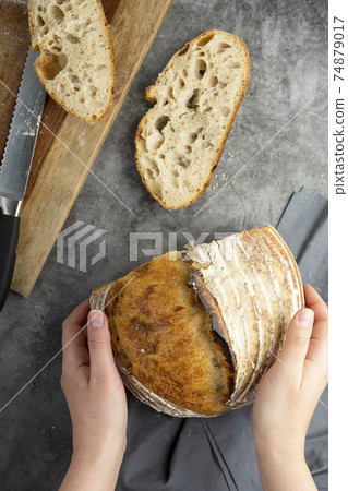Sourdough rustic bread. Traditional homemade bread, top view, copy space. 74879017