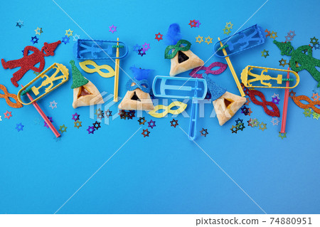 Purim celebration concept. Jewish carnival background. Top view. Flat lay 74880951