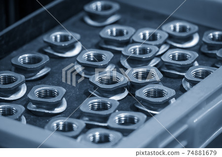 The pile of special industrial nuts . 74881679