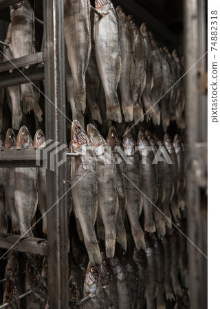 Smoked fish production concept 74882318