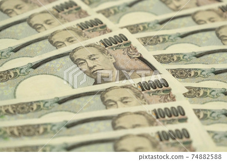 10,000 yen bills lined up to fill the screen 74882588
