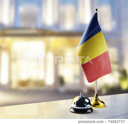 Romania flag on the reception desk in the lobby of the hotel Romania flag on the reception desk in the lobby of the hotel 74882737
