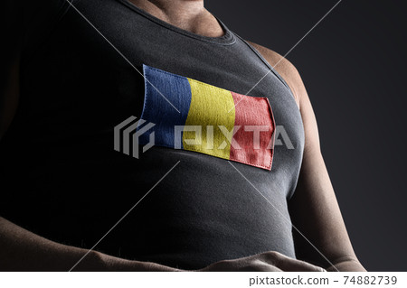 The national flag of Romania on the athlete's chest The national flag of Romania on the athlete's chest 74882739