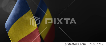 Small national flags of the Romania on a dark background Small national flags of the Romania on a dark background 74882742