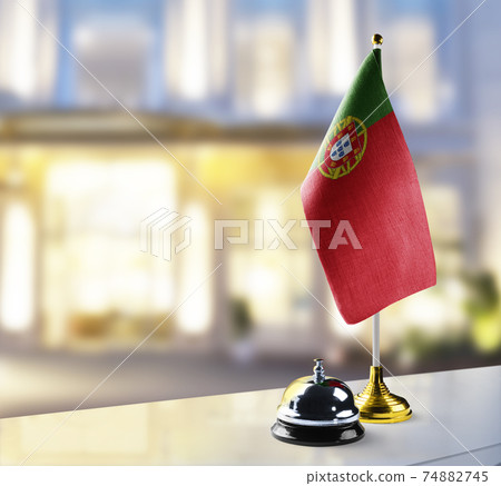 Portugal flag on the reception desk in the lobby of the hotel Portugal flag on the reception desk in the lobby of the hotel 74882745
