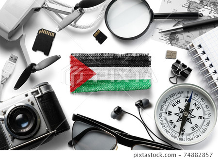Flag of Palestine and travel accessories on a white background. 74882857