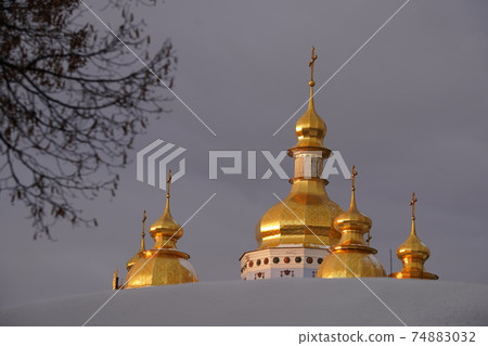 Golden domes of St. Michaels Cathedral in Kiev against the sky 74883032