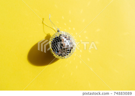 Disco balls on blue background 74883089