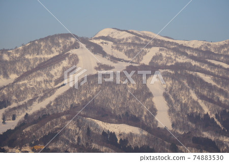 Mt. Dainichi in winter in the Hakusan mountain range with ski resorts Mt. Dainichi in winter in the Hakusan mountain range with ski resorts 74883530