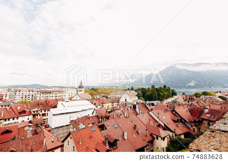 Annecy city top view, lake in the distance. Tile roofs, Cathedral 74883628