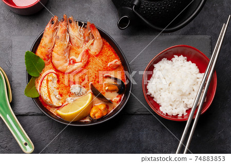 Traditional Thai soup Tom Yum and rice bowl Traditional Thai soup Tom Yum and rice bowl 74883853