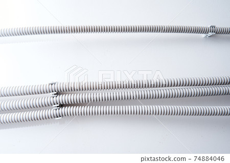 Electric cable corrugated on ceiling. Cable laying ceiling 74884046
