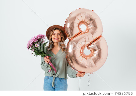 Young beautiful woman celebrating International Women's Day Young beautiful woman celebrating International Women's Day 74885796