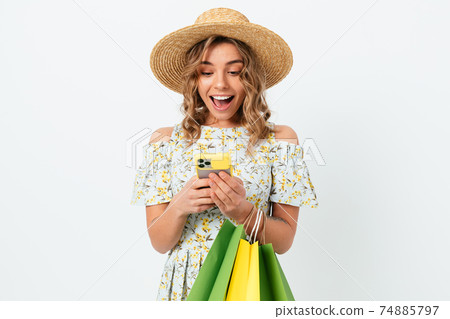 Portrait young beautiful woman in summer dress and straw hat Portrait young beautiful woman in summer dress and straw hat 74885797