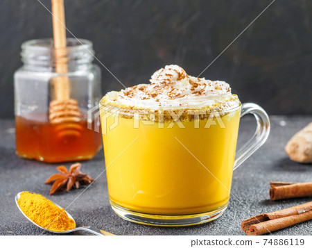golden turmeric latte and ingredients, copy space golden turmeric latte and ingredients, copy space 74886119