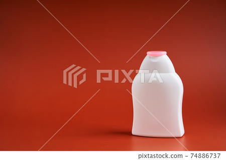 Blank white plastic container from shower gel or shampoo or liquid soap Blank white plastic container from shower gel or shampoo or liquid soap 74886737