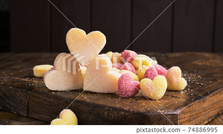 Gnocchi and Parmesan. Traditional Italian pasta with heart-shaped potatoes in different colors 74886995