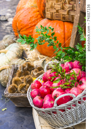 Fruit market with chestnut ,pumpkins and garnet in Campo di Fiori, Rome 74887136