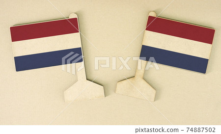 Flags of Netherlands made of recycled paper on the cardboard desk, flat layout Flags of Netherlands made of recycled paper on the cardboard desk, flat layout 74887502