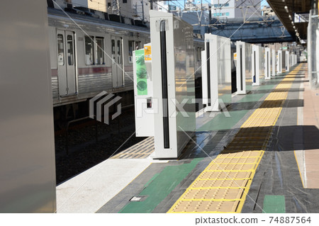 Railroad platform door under construction 74887564