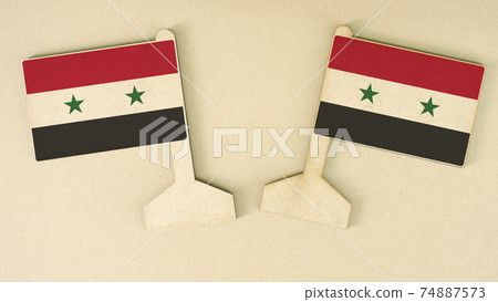 Flags of Syria made of recycled paper on the cardboard desk, flat layout Flags of Syria made of recycled paper on the cardboard desk, flat layout 74887573