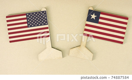 Flags of the USA and Liberia made of recycled paper on the cardboard desk, flat layout Flags of the USA and Liberia made of recycled paper on the cardboard desk, flat layout 74887584