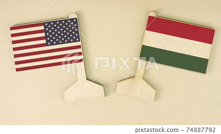 Flags of the USA and Hungary made of recycled paper on the cardboard desk, flat layout, top-down view Flags of the USA and Hungary made of recycled paper on the cardboard desk, flat layout, top-down view 74887792