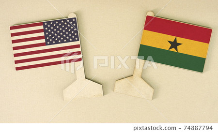 Flags of the USA and Ghana made of recycled paper on the cardboard desk, flat layout, top-down view Flags of the USA and Ghana made of recycled paper on the cardboard desk, flat layout, top-down view 74887794