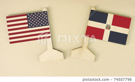 Flags of the USA and Dominican Republic made of recycled paper on the cardboard desk, flat layout Flags of the USA and Dominican Republic made of recycled paper on the cardboard desk, flat layout 74887796