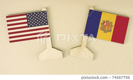 Flags of the USA and Andorra made of recycled paper on the cardboard desk, flat layout Flags of the USA and Andorra made of recycled paper on the cardboard desk, flat layout 74887798