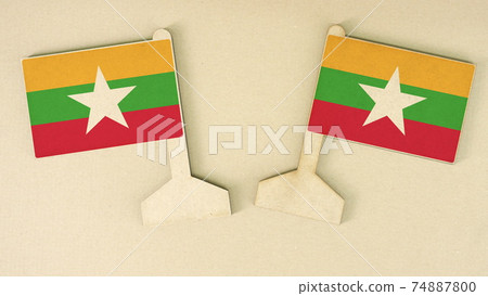Flags of Myanmar made of recycled paper on the cardboard desk, flat layout Flags of Myanmar made of recycled paper on the cardboard desk, flat layout 74887800