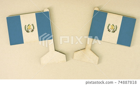 Flags of Guatemala made of cardboard on the desk, flat layout Flags of Guatemala made of cardboard on the desk, flat layout 74887818