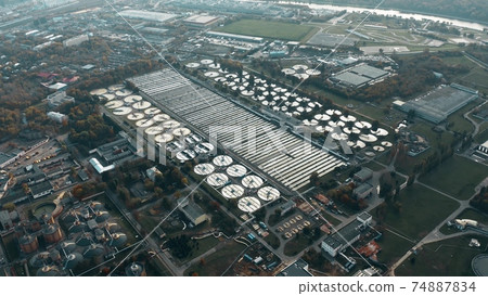 Aerial shot of clarifiers of a wastewater treatment plant in Moscow, Russia Aerial shot of clarifiers of a wastewater treatment plant in Moscow, Russia 74887834