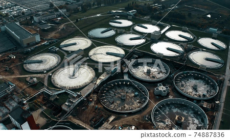 Wastewater treatment facility, aerial shot Wastewater treatment facility, aerial shot 74887836