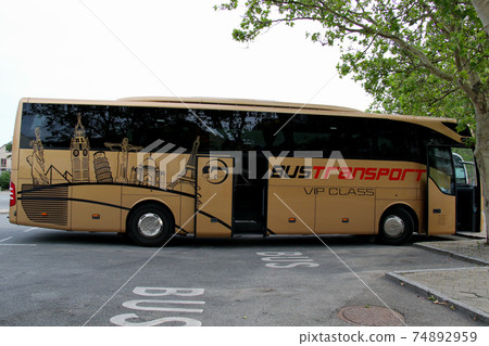 Kronborg Castle, a famous castle of world cultural heritage built in the suburbs of Copenhagen, Denmark, a bus stopped at the parking lot 74892959