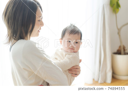 Baby hugged in Mama 74894555