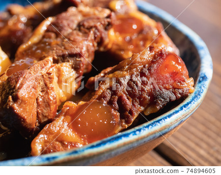 Local cuisine of Kagoshima, Japan. A close-up of a dish of pork simmered in a sweet and spicy sauce. 74894605