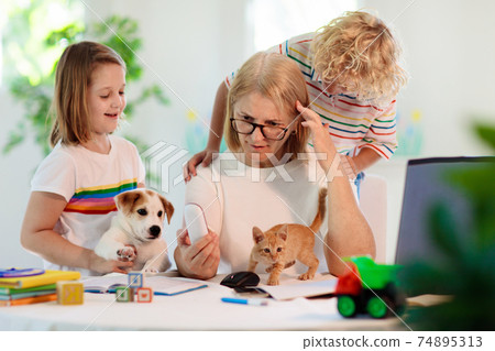 Mother working from home with kids. Quarantine. 74895313