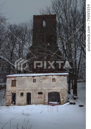 German outbuilding, against the background of the destroyed Kirche. German outbuilding, against the background of the destroyed Kirche. 74895834