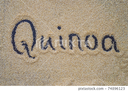 Quinoa on a black background and an inscription with a finger - Quinoa Quinoa on a black background and an inscription with a finger - Quinoa 74896123