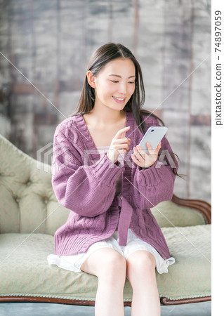 Beauty girls search for smartphones 74897059
