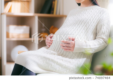 Pregnant woman with a stomach Pregnant woman with a stomach 74897464