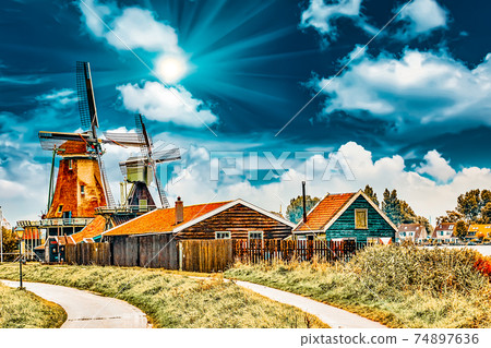 Unique old, authentic, real working windmills in the suburbs of Amsterdam, the Netherlands. Unique old, authentic, real working windmills in the suburbs of Amsterdam, the Netherlands. 74897636