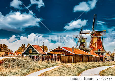 Unique old, authentic, real working windmills in the suburbs of Amsterdam, the Netherlands. Unique old, authentic, real working windmills in the suburbs of Amsterdam, the Netherlands. 74897637