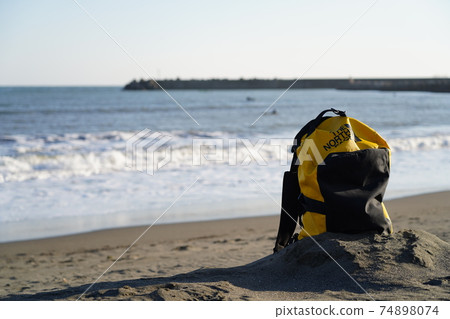 A rucksack on a sandy beach A rucksack on a sandy beach 74898074